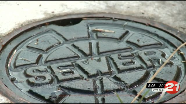 Who should pay to extend SE Bend sewer?