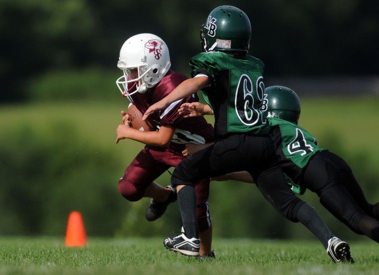 Is it OK for grade-school kids to play tackle football?