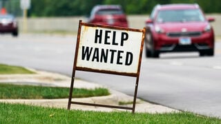 Should unemployment benefits be reduced when the unemployment rate is low?