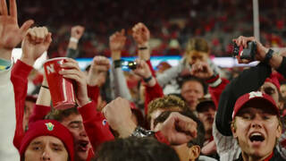 How will selling alcohol at Memorial Stadium affect the game-day experience?