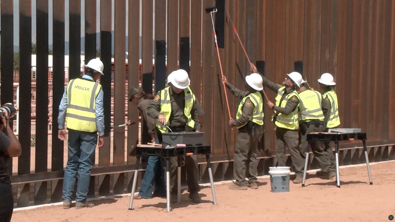 Do you agree that the border wall should be painted black?